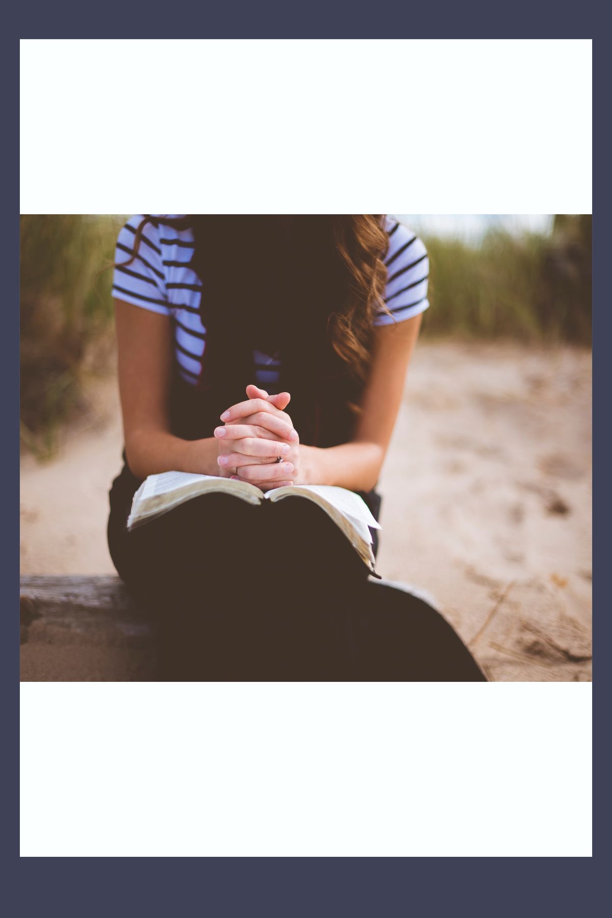 college girl holding a Bible and praying. 